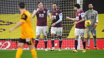 Soccer Football - Premier League - Burnley v Wolverhampton Wanderers - Turf Moor, Burnley, Britain - December 21, 2020 Burnley's Chris Wood celebrates scoring their second goal with Dwight McNeil and Robbie Brady Pool via REUTERS/Peter Powell EDITORI