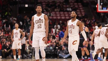 De'Andre Hunter #12 and Donovan Mitchell #45 of the Cleveland Cavaliers react against the Chicago Bulls during the second half at the United Center on December 17, 2025 in Chicago, Illinois.