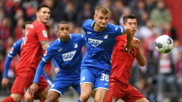 Soccer Football - Bundesliga - Bayern Munich v TSG 1899 Hoffenheim - Allianz Arena, Munich, Germany - October 5, 2019 TSG 1899 Hoffenheim's Stefan Posch in action with Bayern Munich's Robert Lewandowski REUTERS/Andreas Gebert DFL regulat