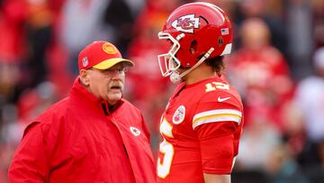 KANSAS CITY, MISSOURI - DECEMBER 10: Patrick Mahomes #15 of the Kansas City Chiefs talks with head coach Andy Reid before the game against the Buffalo Bills at GEHA Field at Arrowhead Stadium on December 10, 2023 in Kansas City, Missouri.   Jamie Squire/Getty Images/AFP (Photo by JAMIE SQUIRE / GETTY IMAGES NORTH AMERICA / Getty Images via AFP)