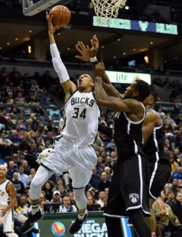 Giannis Antetokounmpo y Thomas Robinson.