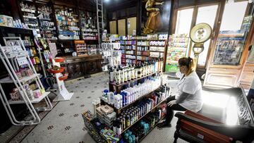 BUENOS AIRES, ARGENTINA - APRIL 08: A pharmacy employee wearing a face mask sorts items on shelves at &#039;Farmacia de la Estrella&#039; on April 08, 2020 in Buenos Aires, Argentina. &#039;Farmacia de la Estrella&#039; is the first pharmacy of Buenos Aires city, founded in 1834 by Dr. Bernardino Rivadavia and still preserves its original decoration. President Alberto Fernandez informed that the lock down will be extended beyond April 12. Argentina was the first country in South America to order mandatory isolation, since March 20. (Photo by Marcelo Endelli/Getty Images)