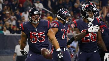 HOUSTON, TX - OCTOBER 25: Greg Mancz #65 of the Houston Texans spikes the ball after a touchdown run by Lamar Miller #26 against the Miami Dolphins in the first quarter at NRG Stadium on October 25, 2018 in Houston, Texas.   Bob Levey/Getty Images/AFP
 ==