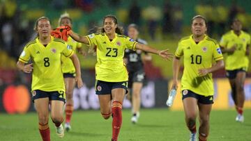 Colombian players Colombia's Angie Castañeda (L), Colombia's Elexa Bahr (C) and Colombia's Leicy Santos celebrate at the end of the Conmebol 2022 women's Copa America football tournament semifinal match between Colombia and Argentina at the Alfonso Lopez stadium in Bucaramanga, Colombia, on July 25, 2022. (Photo by Raul ARBOLEDA / AFP) (Photo by RAUL ARBOLEDA/AFP via Getty Images)