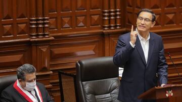 Handout picture released by the Peruvian Presidency showing President Martin Vizcarra standing next to congress speaker Manuel Marino as he presents a statement in Congress where he is facing an impeachment trial, in Lima on September 18, 2020. - Vizcarra remained defiant Friday as Peru&#039;s congress began an impeachment debate ahead of a vote that analysts say he is expected to survive as his opponents in congress are likely to fall short of the votes needed to oust him. Vizcarra, in power since 2018, came under fire after leaked audio recordings in which he is heard telling aides to hide details from congressional investigators of his office&#039;s controversial hiring of a popular singer as a paid cultural advisor. (Photo by Andres VALLE / Peruvian Presidency / AFP) / RESTRICTED TO EDITORIAL USE - MANDATORY CREDIT &quot;AFP PHOTO / PERUVIAN PRESIDENCY / ANDRES VALLE&quot; - NO MARKETING - NO ADVERTISING CAMPAIGNS - DISTRIBUTED AS A SERVICE TO CLIENTS