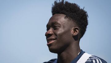 Vancouver Whitecaps MLS soccer team midfielder Alphonso Davies smiles as he leaves the field following practice in Vancouver, Monday, July 23, 2018. (Darryl Dyck/The Canadian Press via AP)