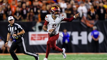 Sep 23, 2024; Cincinnati, Ohio, USA; Washington Commanders quarterback Jayden Daniels (5) runs with the ball against the Cincinnati Bengals in the first half at Paycor Stadium. Mandatory Credit: Katie Stratman-Imagn Images