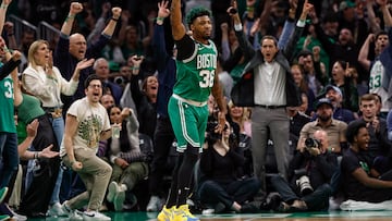 May 25, 2023; Boston, Massachusetts, USA; Actor Christopher Mintz-Plasse (left, in glasses), widely known for playing Fogell (McLovin) in the film Superbad cheers after Boston Celtics guard Marcus Smart (36) made a three point basket during the first quarter of game five of the Eastern Conference Finals against the Miami Heat in the 2023 NBA playoffs at TD Garden. Mandatory Credit: Winslow Townson-USA TODAY Sports