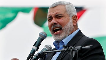 FILE PHOTO: Ismail Haniyeh, prime minister of the Hamas Gaza government, talks to his supporters during a Hamas rally marking the anniversary of the death of its leaders killed by Israel, in Gaza City March 23, 2014. REUTERS/Mohammed Salem/File Photo