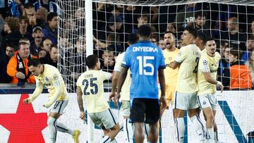 FC Porto's players react after first penalty been stopped by FC Porto's Portuguese goalkeeper Diogo Costa (C) during the UEFA Champions League Group B second leg football match between Club Brugge KV (BEL) and FC Porto (POR) at the Jan Breydel Stadium in Bruges on October 26, 2022. (Photo by Kenzo TRIBOUILLARD / AFP) (Photo by KENZO TRIBOUILLARD/AFP via Getty Images)