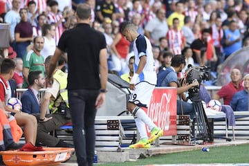 Fajr (right) leaves the field after his first-half sending-off.