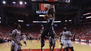 HOUSTON, TX - MAY 11: Dejounte Murray #5 of the San Antonio Spurs dunks against James Harden #13 and Lou Williams #12 of the Houston Rockets during Game Six of the NBA Western Conference Semi-Finals at Toyota Center on May 11, 2017 in Houston, Texas. NOTE TO USER: User expressly acknowledges and agrees that, by downloading and or using this photograph, User is consenting to the terms and conditions of the Getty Images License Agreement. Ronald Martinez/Getty Images/AFP
== FOR NEWSPAPERS, INTERNET, TELCOS & TELEVISION USE ONLY ==