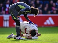 Nottingham Forest's German goalkeeper #27 Stefan Ortega (L) checks on Liverpool's Dutch defender #04 Virgil van Dijk (R) during the English Premier League football match between Nottingham Forest and Liverpool at The City Ground in Nottingham, central England on February 22, 2026. (Photo by Ben STANSALL / AFP) / RESTRICTED TO EDITORIAL USE. No use with unauthorized audio, video, data, fixture lists, club/league logos or 'live' services. Online in-match use limited to 120 images. An additional 40 images may be used in extra time. No video emulation. Social media in-match use limited to 120 images. An additional 40 images may be used in extra time. No use in betting publications, games or single club/league/player publications. /