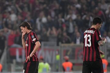 Riccardo Montolivo y  Alessio Romagnoli.