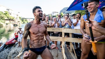 Carlos Gimeno of Spain reacts after winning while Oleksiy Prygorov (R) of the Ukrane watches on during the final competition day of the fifth stop of the Red Bull Cliff Diving World Series in Mostar, Bosnia and Herzegovina on September 9, 2023. // Dean Treml / Red Bull Content Pool // SI202309090435 // Usage for editorial use only //