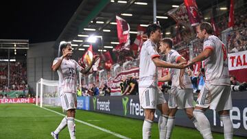 Bayern Munich's English forward #09 Harry Kane celebrates scoring the 2-3 goal with his teammates during the German Cup (DFB Pokal) first round football match between SV Wehen Wiesbaden and FC Bayern Munich in Wiesbaden, western Germany on August 27, 2025. (Photo by Kirill KUDRYAVTSEV / AFP) / DFB REGULATIONS PROHIBIT ANY USE OF PHOTOGRAPHS AS IMAGE SEQUENCES AND QUASI-VIDEO.