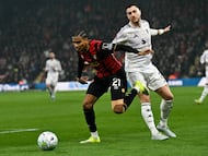 Bournemouth's Morrocan midfielder #21 Amine Adli (L) fights for the ball with Manchester United's Portuguese defender #02 Diogo Dalot during the English Premier League football match between Bournemouth and Manchester United at the Vitality Stadium in Bournemouth, southern England on March 20, 2026. (Photo by Glyn KIRK / AFP) / RESTRICTED TO EDITORIAL USE. No use with unauthorized audio, video, data, fixture lists, club/league logos or 'live' services. Online in-match use limited to 120 images. An additional 40 images may be used in extra time. No video emulation. Social media in-match use limited to 120 images. An additional 40 images may be used in extra time. No use in betting publications, games or single club/league/player publications. /