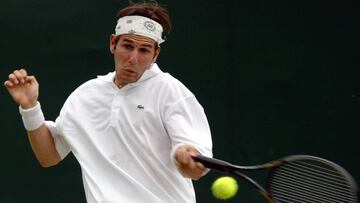 (FILES) This file photo taken on June 25, 2002 shows French Jerome Golmard playing a forehand during the first round match against Czech Jan Vacek at the Wimbledon Tennis Championships.
Golmard died of the Charcot disease aged 43, the French Federation of Tennis announced on August 1, 2017. / AFP PHOTO / EPA / SRDJAN SUKI