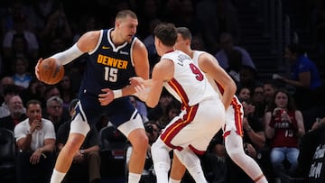 MIAMI, FLORIDA - DECEMBER 29: Nikola Jokic #15 of the Denver Nuggets dribbles the ball against Pelle Larsson #9 of the Miami Heat during the second quarter at Kaseya Center on December 29, 2025 in Miami, Florida. NOTE TO USER: User expressly acknowledges and agrees that, by downloading and or using this photograph, User is consenting to the terms and conditions of the Getty Images License Agreement. Rich Storry/Getty Images/AFP (Photo by Rich Storry / GETTY IMAGES NORTH AMERICA / Getty Images via AFP)