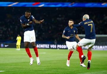 France's Marcus Thuram celebrates scoring his country's second goal against the Republic of Ireland with Antoine Griezmann.