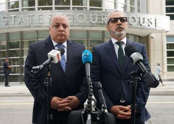 Paulo Peixoto (L) and Julio Barbosa (R), attorneys for Jose Maria Marin, the former head of the Brazilian football federation, speak outside court August 22, 2018 in New York.