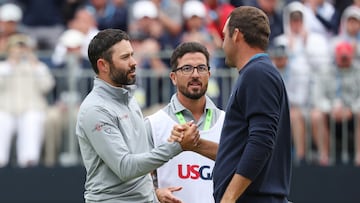 Adam Hadwin and Scottie Scheffler shake hands on the 18th green during the final round of the 122nd U.S. Open Championship at The Country Club on June 19, 2022 in Brookline, Massachusetts.