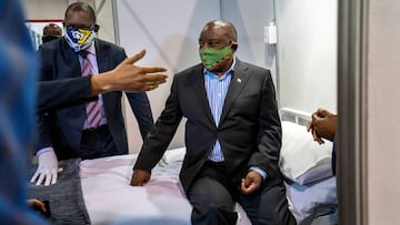 FILE PHOTO: South African President Cyril Ramaphosa visits the coronavirus disease (COVID-19) treatment facilities at the NASREC Expo Centre in Johannesburg, South Africa April 24, 2020. Jerome Delay/Pool via REUTERS/File Photo