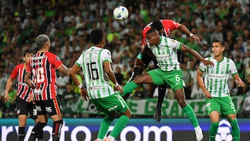 Atletico Nacional's defender #06 Andres Roman (2nd R) jumps for the ball during the Copa Libertadores round of 16 first leg football match between Colombia's Atletico Nacional and Brazil's Sao Paulo, at the Atanasio Girardot stadium in Medellin, Colombia, on August 12, 2025. (Photo by Jaime SALDARRIAGA / AFP)