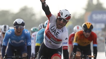 Italy's Diego Ulissi celebrates his victory as he crosses the finish line of the 13th stage of the Giro d'Italia 2020 cycling race, a 192-kilometers route between Cervia and Monselice, on October 16, 2020. (Photo by Luca Bettini / AFP)