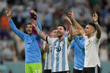 Argentina's forward #10 Lionel Messi reacts with Argentina's forward #22 Lautaro Martinez at the final whistle of the Qatar 2022 World Cup Group C football match between Argentina and Mexico at the Lusail Stadium in Lusail, north of Doha on November 26, 2022. (Photo by JUAN MABROMATA / AFP)