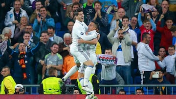Lucas Vazquez (R) of Real Madrid celebrates scoring his team's fourth goal with his team mate Alvaro Morata (L) during the UEFA Champions League Group F match between Real Madrid CF and Legia Warszawa at Bernabeu on October 18, 2016 in Madrid, Spain.