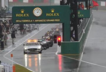 A safety car drives in front as the race is stopped due to heavy rain at the Formula One Japanese Grand Prix in Suzuka on October 5, 2014. AFP PHOTO/ TOSHIFUMI KITAMURA