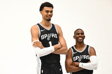 San Antonio Spurs forward #01 Victor Wembanyama and guard #3 Chris Paul pose for photos during a media day ahead of the NBA season at the Victory Capital Performance Center in San Antonio, Texas, September 30, 2024. (Photo by Patrick T. Fallon / AFP)