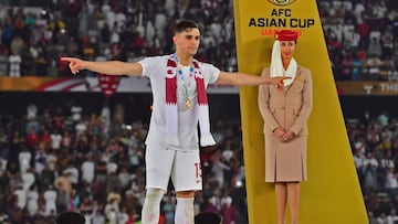 (FILES) A file picture taken on February 1, 2019 shows Qatar&#039;s defender Bassam al-Rawi celebrating his team&#039;s win on the podium during the 2019 AFC Asian Cup final football match between Japan and Qatar at the Zayed Sports City Stadium in Abu Dh