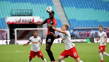 Hertha Berlin's German defender Jordan Torunarigha heads the ball next to Leipzig's German defender Marcel Halstenberg (R) during the German first division Bundesliga football match RB Leipzig v Hertha Berlin on May 27, 2020 in Leipzig, eastern