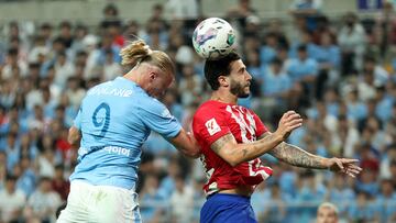 Soccer Football - Pre-Season Friendly - Atletico Madrid v Manchester City - Seoul World Cup Stadium, Seoul, South Korea - July 30, 2023 Atletico Madrid's Mario Hermoso in action with Manchester City's Erling Braut Haaland REUTERS/Kim Hong-Ji