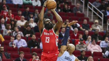 Jan 14, 2019; Houston, TX, USA; Houston Rockets guard James Harden (13) shoots the ball over Memphis Grizzlies guard Jevon Carter (3) during the first quarter at Toyota Center. Mandatory Credit: Troy Taormina-USA TODAY Sports
