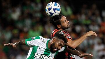 Atletico Nacional's defender Cristian Devenish (L) and Patronato's forward Enzo Diaz fight for the ball during the Copa Libertadores group stage second leg football match between Colombia's Atletico Nacional and Argentina's Patronato, at the Atanasio Girardot stadium in Medellin, Colombia, on June 27, 2023. (Photo by Fredy BUILES / AFP)