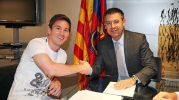 Leo Messi y Josep Maria Bartomeu.