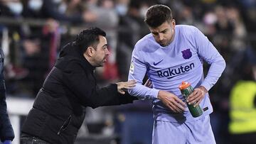 Piqué y Xavi.