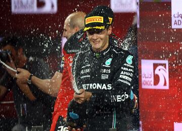 Formula One F1 - Abu Dhabi Grand Prix - Yas Marina Circuit, Abu Dhabi, United Arab Emirates - November 26, 2023 Mercedes' George Russell sprays champagne and celebrates after finishing third Pool via REUTERS/Rula Rouhana