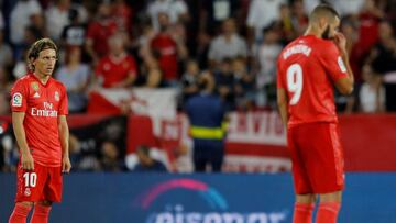 Soccer Football - La Liga Santander - Sevilla v Real Madrid - Ramon Sanchez Pizjuan, Seville, Spain - September 26, 2018 Real Madrid's Luka Modric, Karim Benzema and Raphael Varane react after conceding a goal scored by Sevilla's Andre Silva