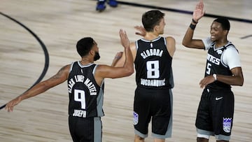 August 6, 2020; Lake Buena Vista, Florida, USA; Sacramento Kings&#039; Cory Joseph (9), Bogdan Bogdanovic (8) and De&#039;Aaron Fox (5) react during the second half of an NBA basketball gameat HP Field House. Mandatory Credit: Ashley Landis/Pool Photo-USA TODAY Sports