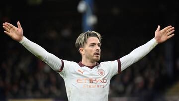 Manchester City's English midfielder #10 Jack Grealish celebrates scoring his team second goal during the English Premier League football match between Luton Town and Manchester City at Kenilworth Road in Luton, north of London on December 10, 2023. (Photo by JUSTIN TALLIS / AFP) / RESTRICTED TO EDITORIAL USE. No use with unauthorized audio, video, data, fixture lists, club/league logos or 'live' services. Online in-match use limited to 120 images. An additional 40 images may be used in extra time. No video emulation. Social media in-match use limited to 120 images. An additional 40 images may be used in extra time. No use in betting publications, games or single club/league/player publications. /