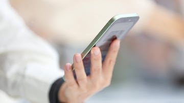 A person holds an iPhone 17 during Apple's event at the Steve Jobs Theater on its campus in Cupertino, California, U.S. September 9, 2025. REUTERS/Manuel Orbegozo