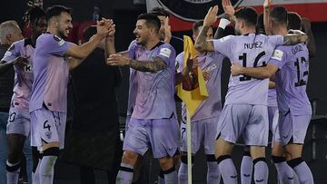 Athletic Bilbao's Spanish defender #04 Aitor Paredes celebrates with teammates after scoring his team's first goal during the Europa League football match between AS Roma and Athletic Bilbao at the Olympic stadium in Rome, on September 26, 2024. (Photo by Filippo MONTEFORTE / AFP)