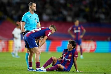 Worried | Barcelona's Spanish midfielder Fermin Lopez checks on teammate Joao Felix.