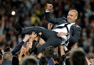 5 May 2012 | Barcelona coach Pep Guardiola is tossed in the air by his Barça players after his last game at the Camp Nou. A 4-0 victory over local rivals Espanyol in which striker Lionel Messi scored four times to take his tally for the season to 72 goals