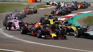 SHANGHAI, CHINA - APRIL 15: Daniel Ricciardo of Australia driving the (3) Aston Martin Red Bull Racing RB14 TAG Heuer battles with Nico Hulkenberg of Germany driving the (27) Renault Sport Formula One Team RS18 on track during the Formula One Grand Prix o