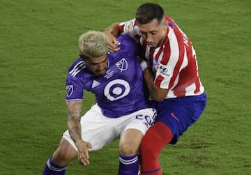 Atlético's Héctor Herrera keeps Alejandro Pozuelo off the ball in last week's MLS All-Star Game